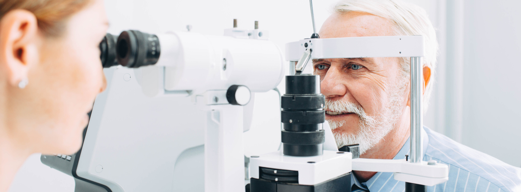 Man having eyes examined